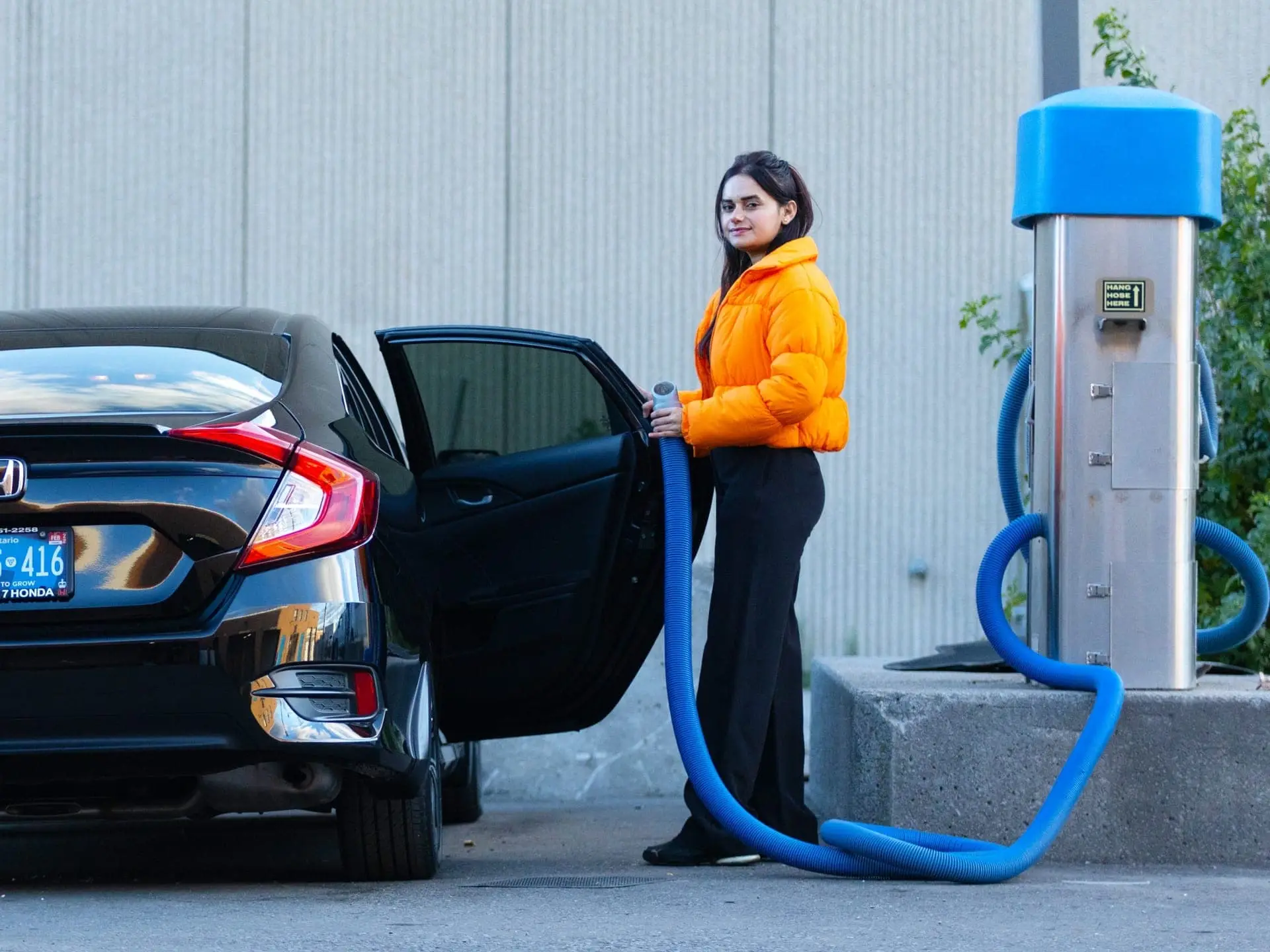 Customer operating the paid self-serve vacuum