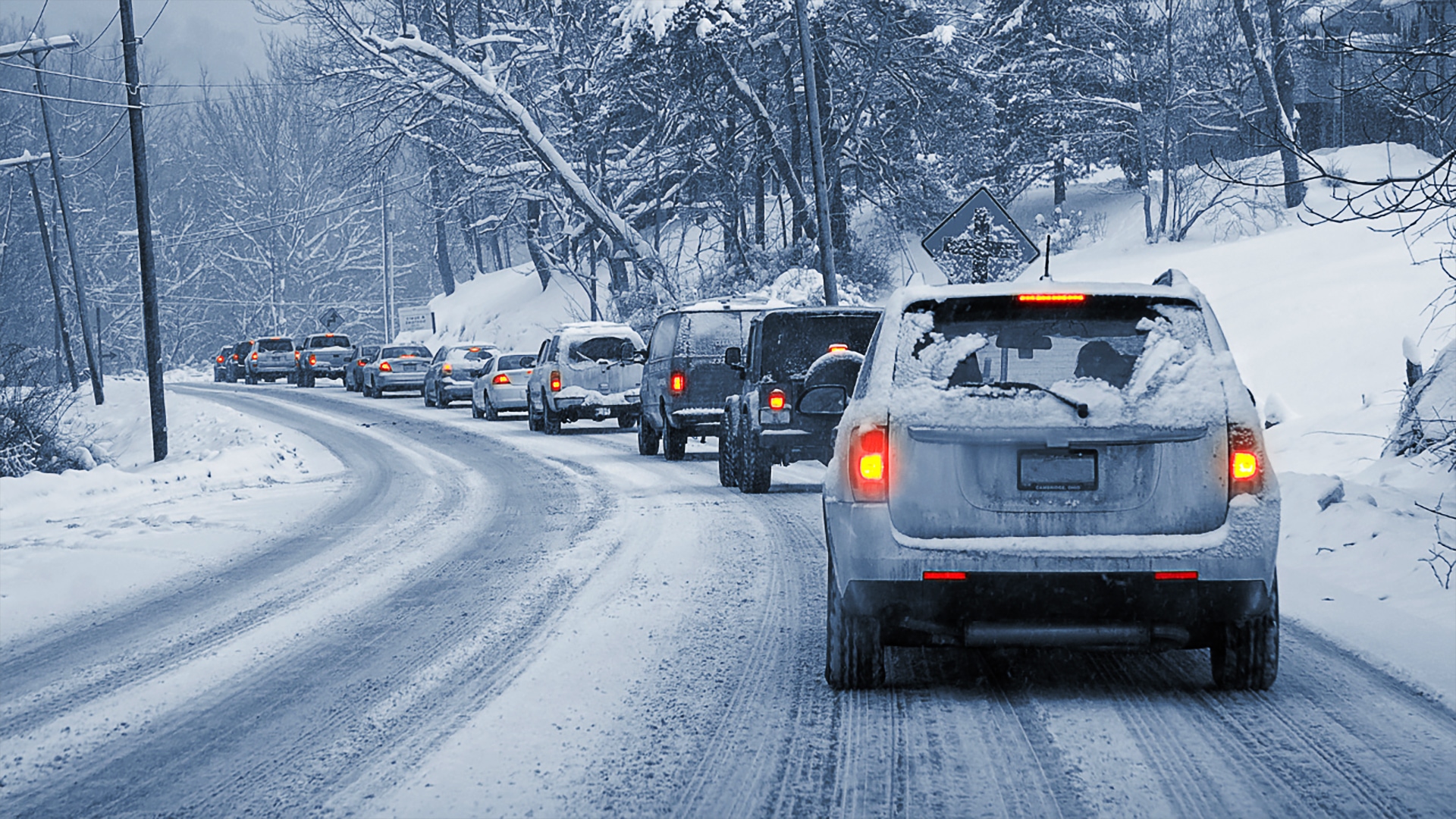 Picture of a car queue in winter, scenic snowy landscape