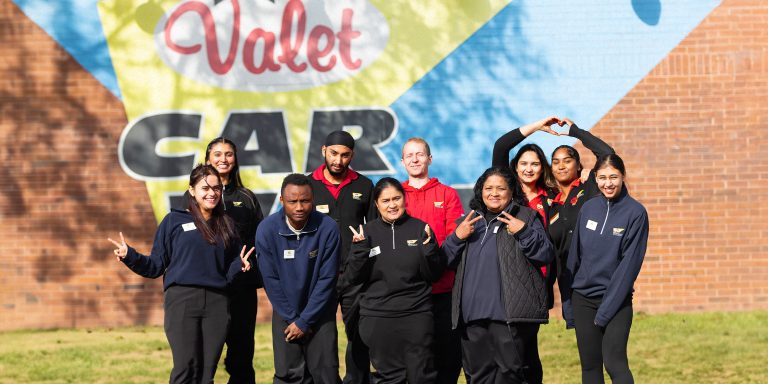 A group of happy Valet experts posing for a picture