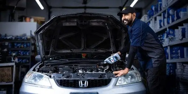 Picture of a Valet expert changing engine oil